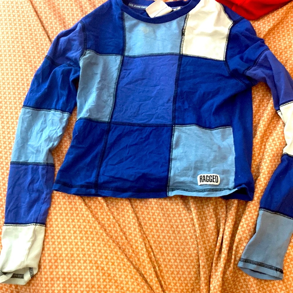 A cute little fun blue long sleeve shirt
